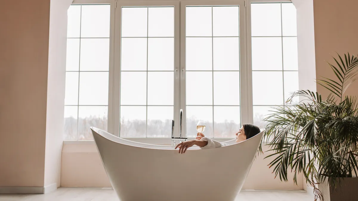 freestanding bathtub in a bright spa-like bathroom