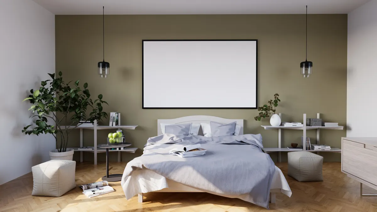 Minimal bedroom with made bed, shelves, and pendant lights