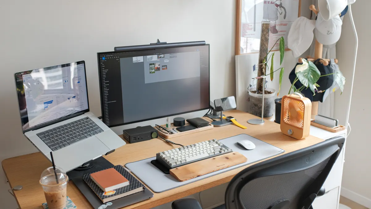 Organized home office desk with dual screens and accessories