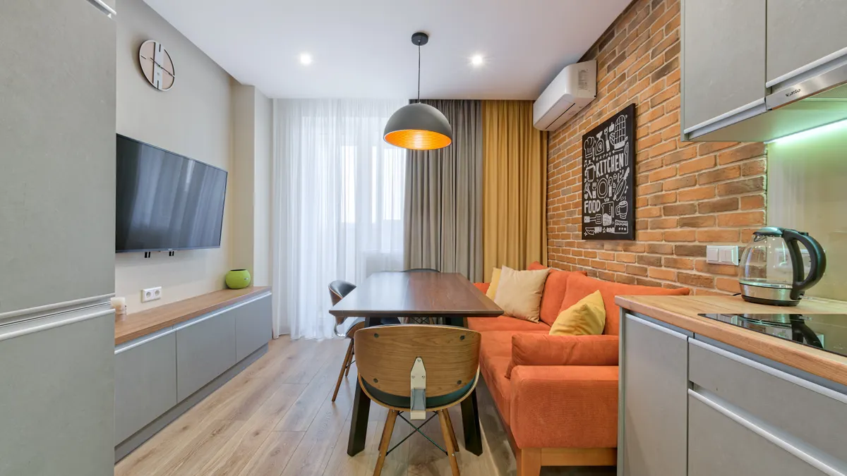 Small apartment living-dining room with sofa and table
